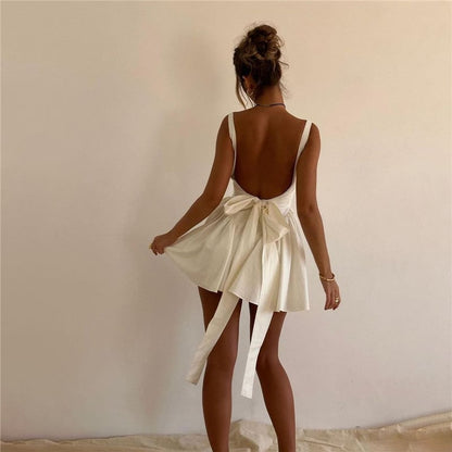 White backless mini dress with bow – Melara